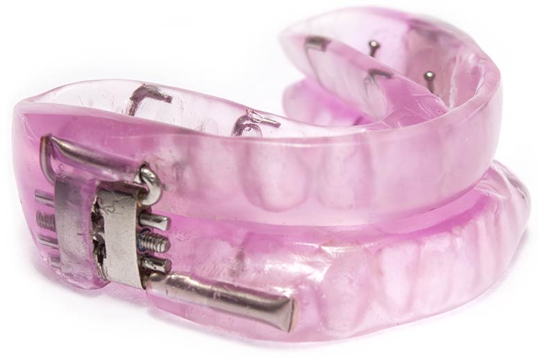 Photo of a purple sleep apnea mouth guard